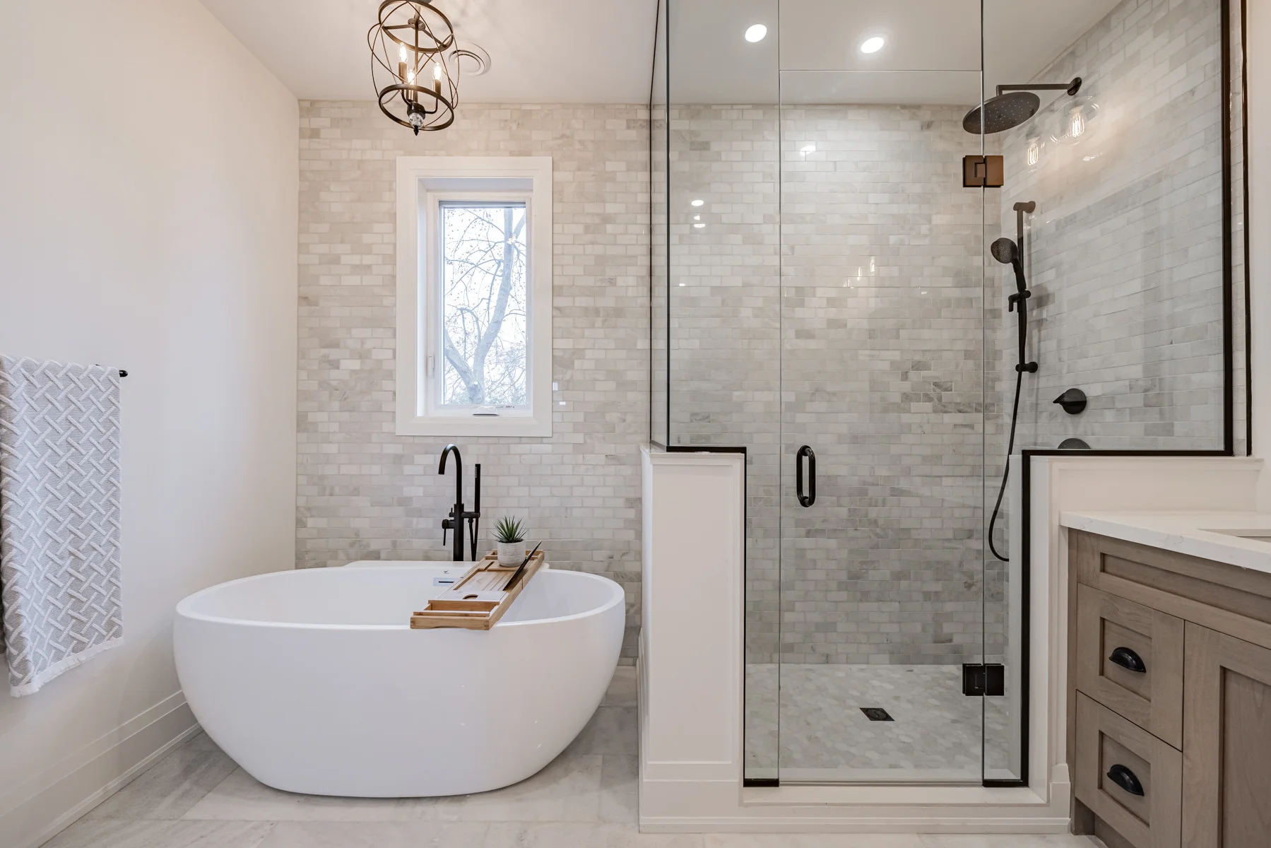 High-end bathroom remodel with custom tile and modern fixtures