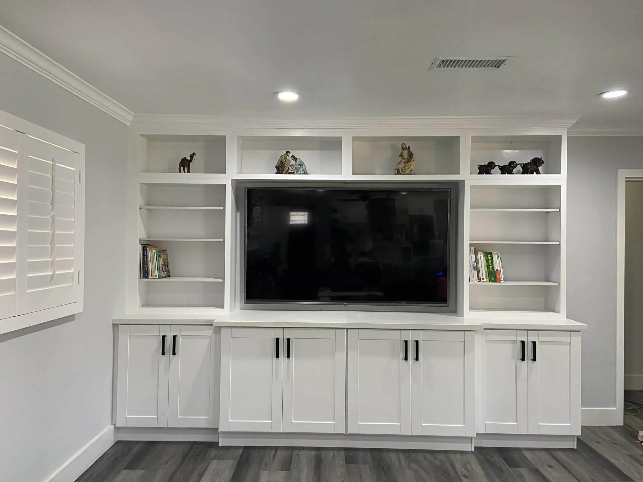 Custom entertainment center with elegant finish and storage